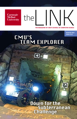 The cover of the winter 2021 issue of the Link shows a stylized version of a robot with large wheels entering a cave.