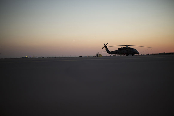 A U.S. Army Blackhawk helicopter sits on the tarmac at an Army base. 