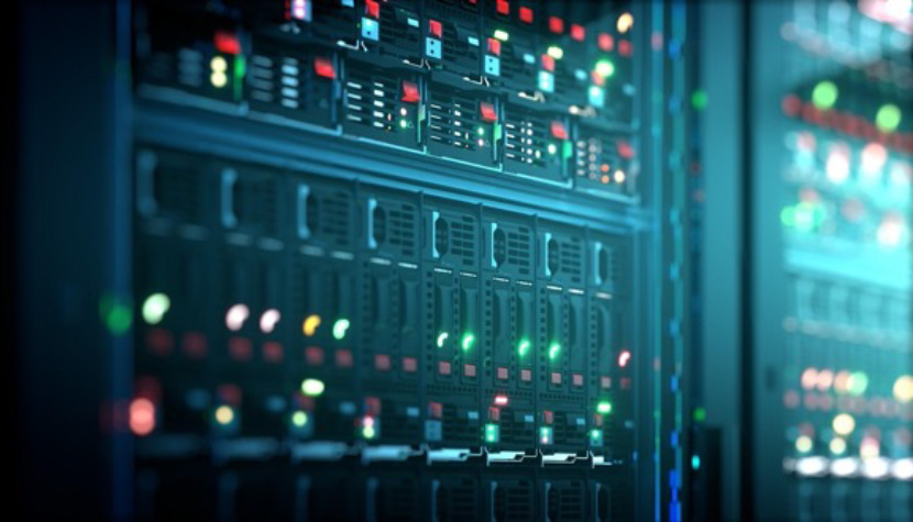 Close-up shot of a computer with red and green lights in a data center.