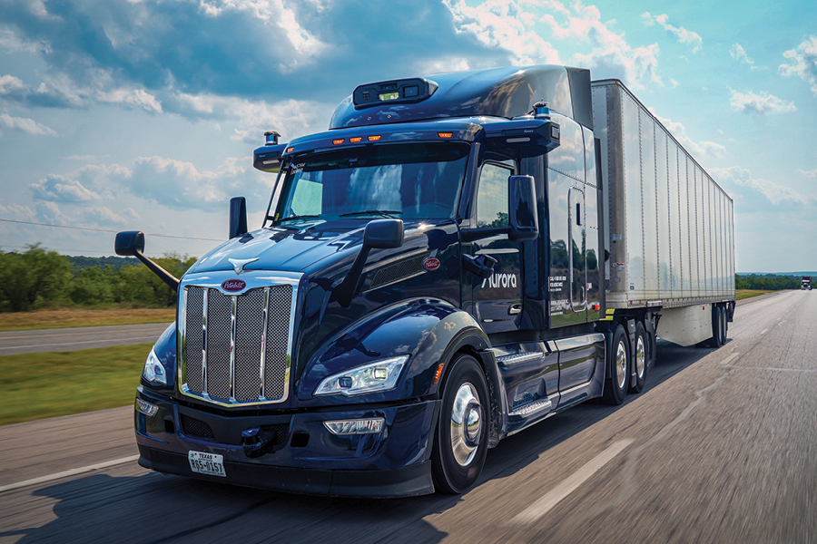  a large self-driving semi-truck travels on a highway road